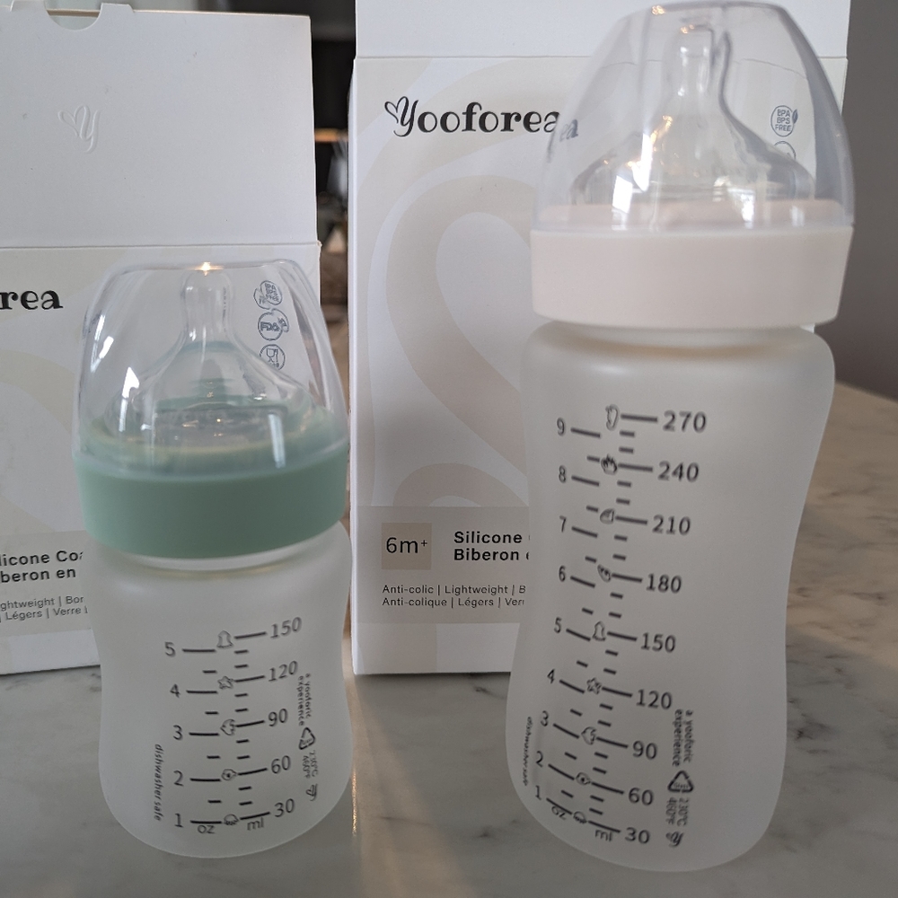 BNIB 4 glass baby bottles, silicone coated